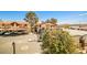 Neighborhood view with mature landscaping, carport, and street parking at 4083 Nook Way # D, Las Vegas, NV 89103