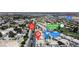 This aerial view shows the community pool, home, and Painted Desert Golf Club at 4800 Grey Wolf Ln # 202, Las Vegas, NV 89149