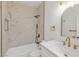 Bathroom featuring a tub, shower, marbled walls, and a modern vanity at 4800 Grey Wolf Ln # 202, Las Vegas, NV 89149