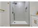 Stylish walk-in shower with gray vertical tile and modern fixtures at 4800 Grey Wolf Ln # 202, Las Vegas, NV 89149