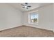 Bright bedroom with a ceiling fan and a large window offering scenic views at 4800 Grey Wolf Ln # 202, Las Vegas, NV 89149