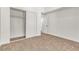 Bedroom featuring neutral carpeting and a closet with sliding doors at 4800 Grey Wolf Ln # 202, Las Vegas, NV 89149