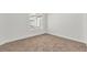 Bright bedroom with neutral carpet, fresh white walls, and a window view at 4800 Grey Wolf Ln # 202, Las Vegas, NV 89149
