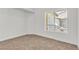Bright bedroom with neutral carpet, fresh white walls, and a window view at 4800 Grey Wolf Ln # 202, Las Vegas, NV 89149