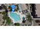 Beautiful community pool surrounded by lush landscaping at 4800 Grey Wolf Ln # 202, Las Vegas, NV 89149