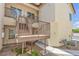 A low rise complex with a walkway, stairs and landscaping at the side of the home at 4800 Grey Wolf Ln # 202, Las Vegas, NV 89149