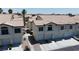 Aerial view of townhomes with garages and well-maintained landscaping at 4800 Grey Wolf Ln # 202, Las Vegas, NV 89149
