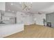Open concept kitchen with stainless appliances, island and hardwood floors at 4800 Grey Wolf Ln # 202, Las Vegas, NV 89149