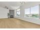 Well lit living room showcasing views, high ceilings, wood floors and modern fireplace at 4800 Grey Wolf Ln # 202, Las Vegas, NV 89149