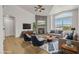 Bright living room with modern fireplace, vaulted ceilings, and mountain views from large windows at 4800 Grey Wolf Ln # 202, Las Vegas, NV 89149