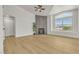 Spacious living room featuring new light wood floors, high ceiling and a modern fireplace at 4800 Grey Wolf Ln # 202, Las Vegas, NV 89149