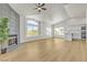 Open floor plan with hardwood floors, modern fireplace and adjacent updated kitchen at 4800 Grey Wolf Ln # 202, Las Vegas, NV 89149