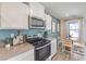 Well-lit kitchen featuring stainless steel appliances, quartz countertops, and ample cabinetry at 4979 Sage Mesa Ave # Lot 147, Las Vegas, NV 89139