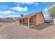 Gravel backyard with covered patio and block fencing at 503 Credence Ave, Henderson, NV 89002