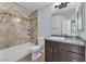 Updated bathroom with tiled shower and granite vanity at 503 Credence Ave, Henderson, NV 89002