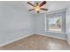 This bedroom includes a ceiling fan and window with natural light at 503 Credence Ave, Henderson, NV 89002
