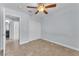 Light and airy bedroom featuring tile floors and a ceiling fan at 503 Credence Ave, Henderson, NV 89002