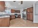An updated kitchen featuring stainless steel appliances, granite countertops, and wood cabinets at 503 Credence Ave, Henderson, NV 89002