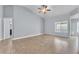 Open floorplan living room with tiled floors and neutral walls at 503 Credence Ave, Henderson, NV 89002