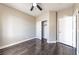 Bedroom featuring hardwood floors, neutral walls, ceiling fan, and closet at 5079 Quiet Falls Ct, Las Vegas, NV 89141