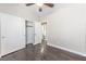 Bedroom features hardwood floors, neutral walls, ceiling fan, closet and ensuite bathroom at 5079 Quiet Falls Ct, Las Vegas, NV 89141