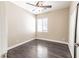 Bedroom featuring ceiling fan, window with blinds, and wood flooring at 5079 Quiet Falls Ct, Las Vegas, NV 89141