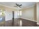 View of the bedroom featuring hardwood floors, a ceiling fan, and a walk-in closet at 5079 Quiet Falls Ct, Las Vegas, NV 89141