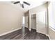 Bedroom featuring closet, window with blinds, and hardwood floors at 5079 Quiet Falls Ct, Las Vegas, NV 89141