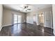 Large bedroom with hardwood floors and a view to the pool through sliding glass door at 5079 Quiet Falls Ct, Las Vegas, NV 89141