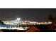 Nighttime city view featuring illuminated buildings and skyline for captivating urban experience at 5079 Quiet Falls Ct, Las Vegas, NV 89141