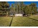 Well-maintained community entrance to Southern Highlands Golf Club with lush greenery and signage at 5079 Quiet Falls Ct, Las Vegas, NV 89141
