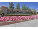 Elegant entrance sign for Southern Highlands surrounded by colorful flowerbeds at 5079 Quiet Falls Ct, Las Vegas, NV 89141