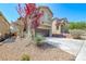 Beautiful home with a well-maintained front yard and an attached garage at 5079 Quiet Falls Ct, Las Vegas, NV 89141