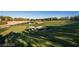 Lush green golf course with sand traps and lake at 5079 Quiet Falls Ct, Las Vegas, NV 89141