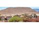 Distant mountain range over rooftops, showcasing community at 5079 Quiet Falls Ct, Las Vegas, NV 89141