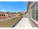 A concrete patio with a view of neighboring houses and a mountain in the distance at 5079 Quiet Falls Ct, Las Vegas, NV 89141