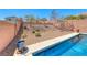 Inviting backyard featuring a sparkling blue pool and serene landscaping at 5079 Quiet Falls Ct, Las Vegas, NV 89141