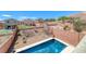 Backyard view from above showcasing a glistening pool surrounded by desert landscaping at 5079 Quiet Falls Ct, Las Vegas, NV 89141