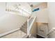 Inviting staircase with white railing, tile floors, and neutral paint offers a warm welcome at 5079 Quiet Falls Ct, Las Vegas, NV 89141