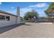 The backyard features a combination of gravel, and block fence, offering privacy at 5079 Reno Ct, Las Vegas, NV 89119