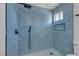 Elegant bathroom boasting a glass-enclosed shower with stylish tile and modern shower fixtures at 5079 Reno Ct, Las Vegas, NV 89119