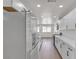 A view of a kitchen with white cabinets, stainless appliances, and stone countertops at 5079 Reno Ct, Las Vegas, NV 89119