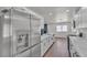 Kitchen view of a stainless steel refrigerator and white kitchen cabinets at 5079 Reno Ct, Las Vegas, NV 89119