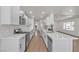 Kitchen featuring white cabinets and stone countertop island with stainless steel appliances at 5079 Reno Ct, Las Vegas, NV 89119
