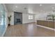 Open-concept living space featuring a modern fireplace, stylish breakfast bar, and outdoor access at 5079 Reno Ct, Las Vegas, NV 89119