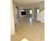 Spacious living room with tile flooring, bright windows, and modern design at 6024 Ripple Cloud Ct, North Las Vegas, NV 89031