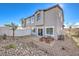 A two-story home with a rock backyard and patio set, perfect for outdoor dining at 6521 Cinnamon Hazelnut St # Lot 91, North Las Vegas, NV 89084