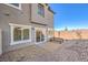 This home has a gravel backyard with a patio and a sliding glass door entrance at 6521 Cinnamon Hazelnut St # Lot 91, North Las Vegas, NV 89084