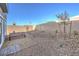 Gravel backyard with a picnic table set and a view of the fence in the distance at 6521 Cinnamon Hazelnut St # Lot 91, North Las Vegas, NV 89084