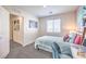 Bright bedroom with a stylish desk, comfortable bed, and ample natural light for a serene setting at 6521 Cinnamon Hazelnut St # Lot 91, North Las Vegas, NV 89084